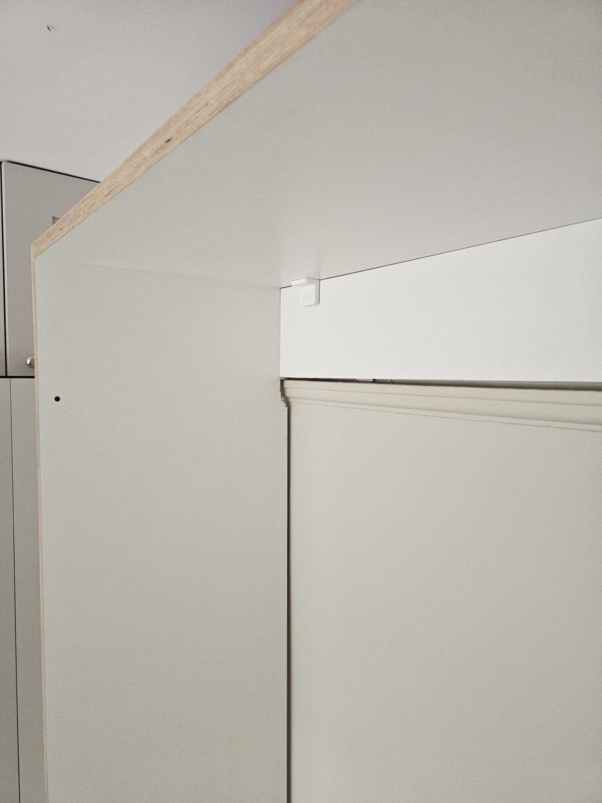 The top of the bed unit notched around a picture rail