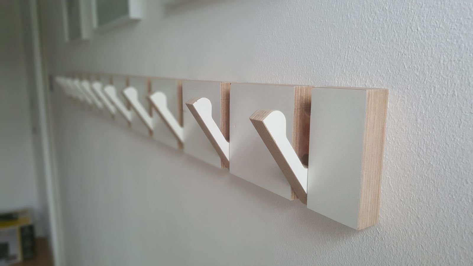 Fold-flat clothes hooks
